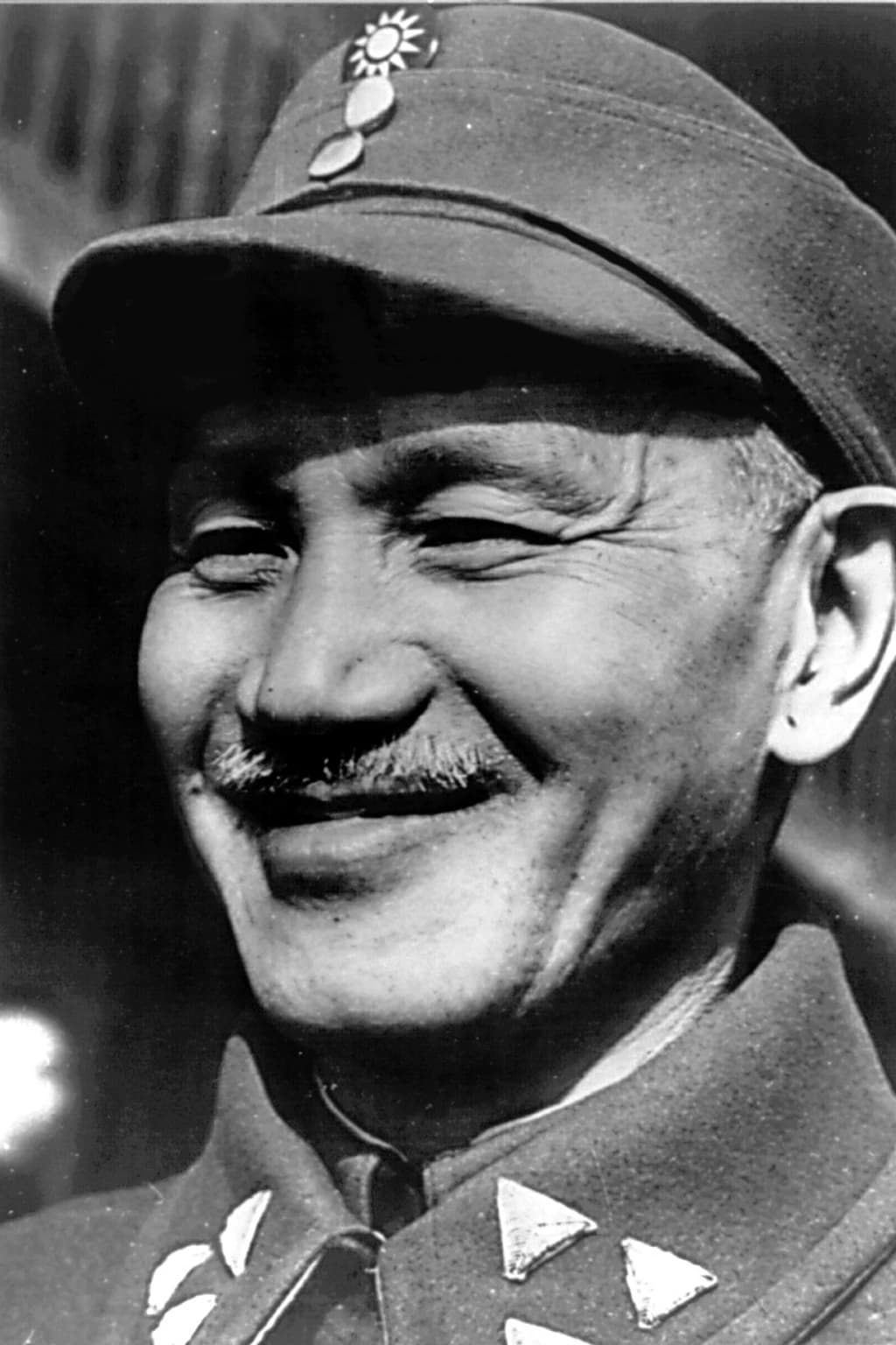Archival photograph of Chiang Kai-shek in military uniform during an Army Air Force base visit, March 1945.